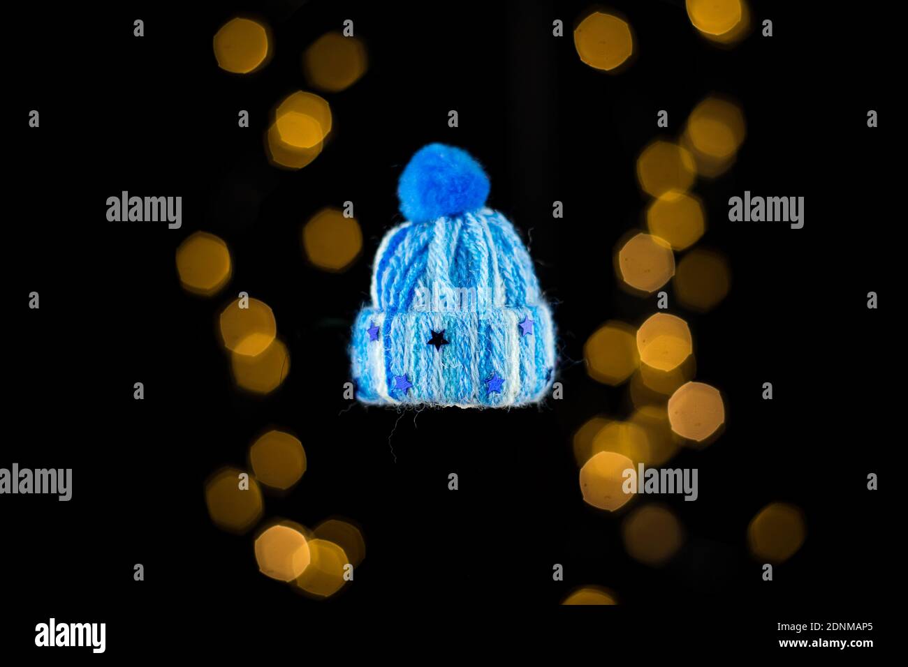 KATOWICE, POLAND - Dec 11, 2020: Decoration for the Christmas tree (cap) on the background of lights. Stock Photo