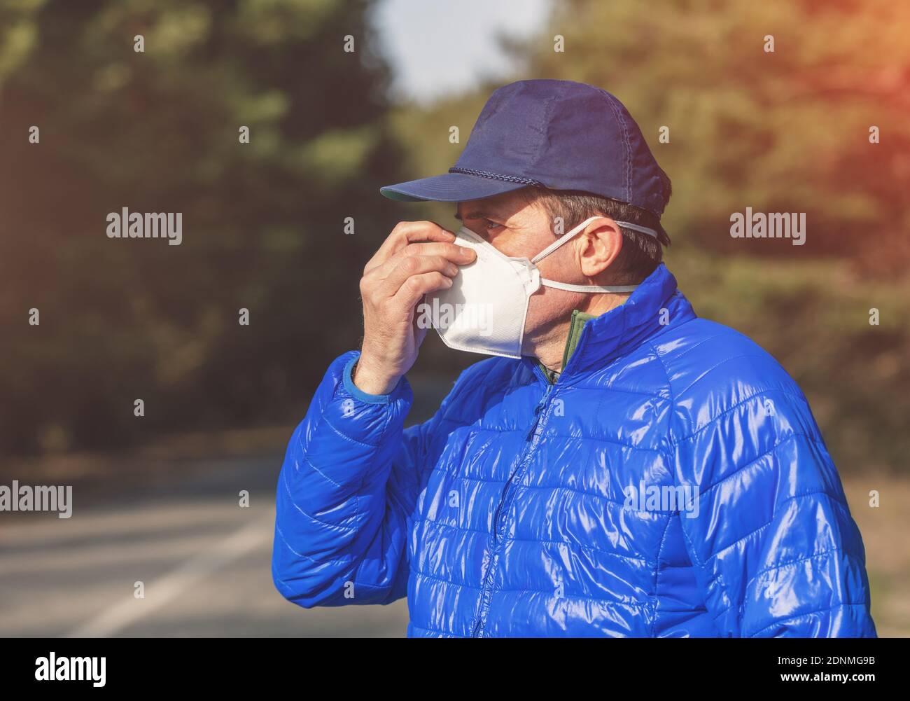 A man in a medical face mask (respirator) outdoors Stock Photo - Alamy