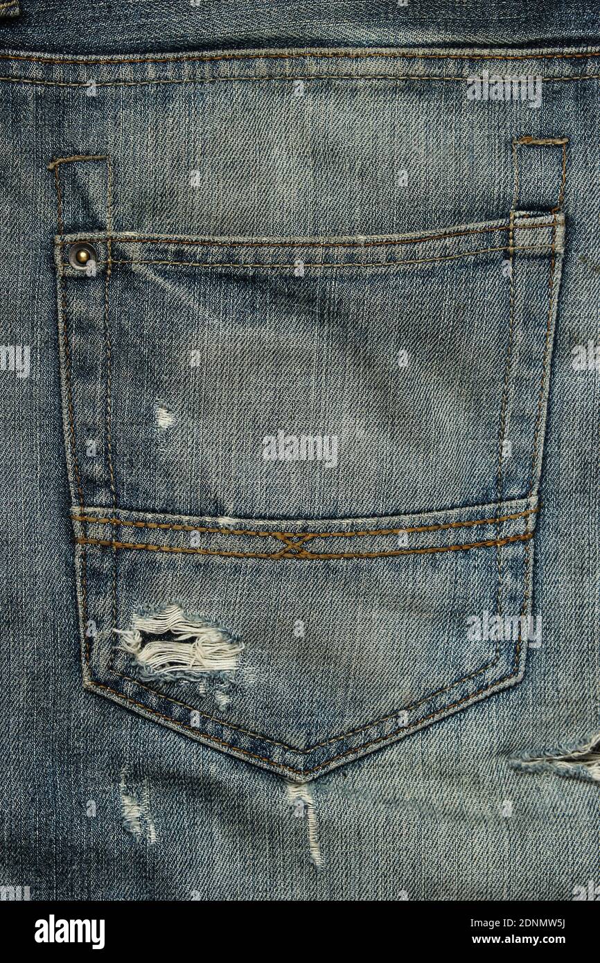 Back pocket of worn torn jeans Stock Photo - Alamy