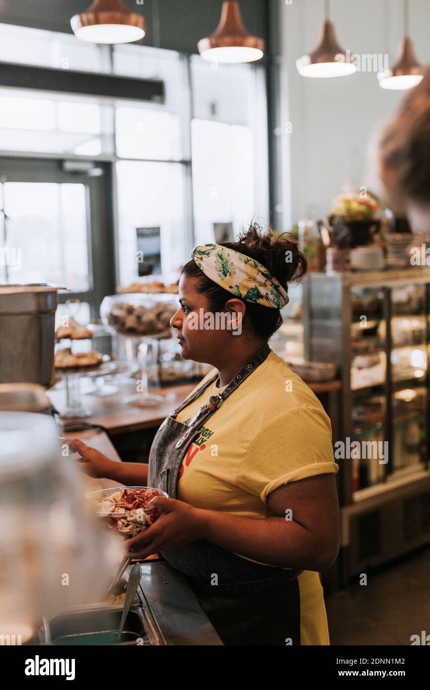 Woman working in cafe Stock Photo