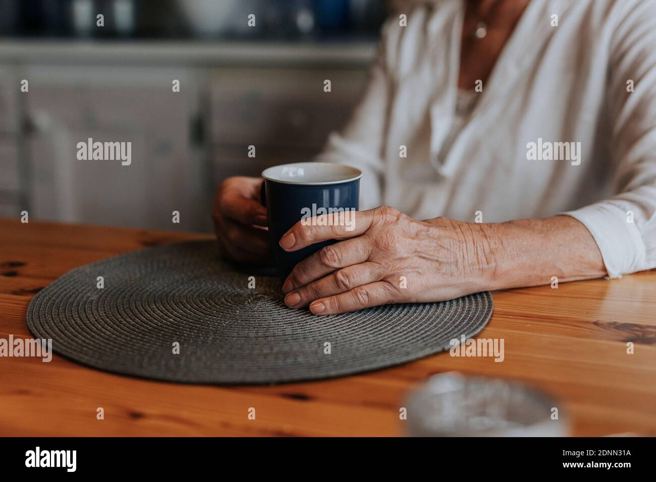 Womans hands holding mug Stock Photo