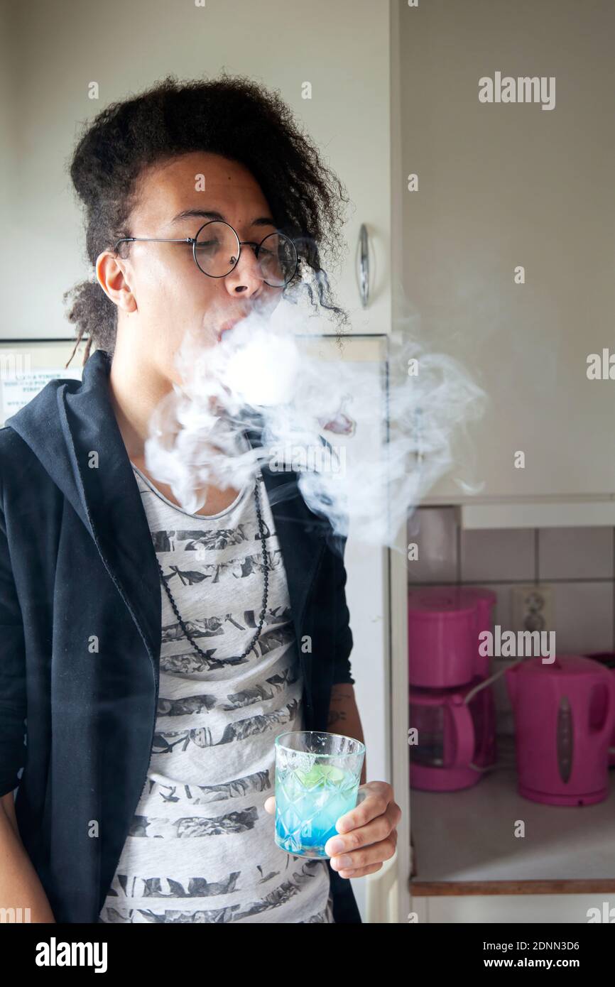 inhaling cigarette Smoking, man inhaling a cigarette, close up Stock Photo