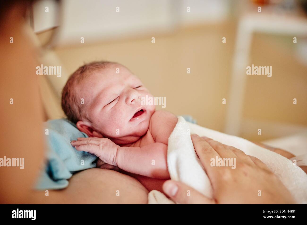 Mother holding newborn baby Stock Photo - Alamy