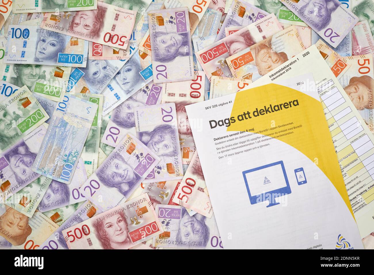 Tax form on Swedish krona banknotes Stock Photo