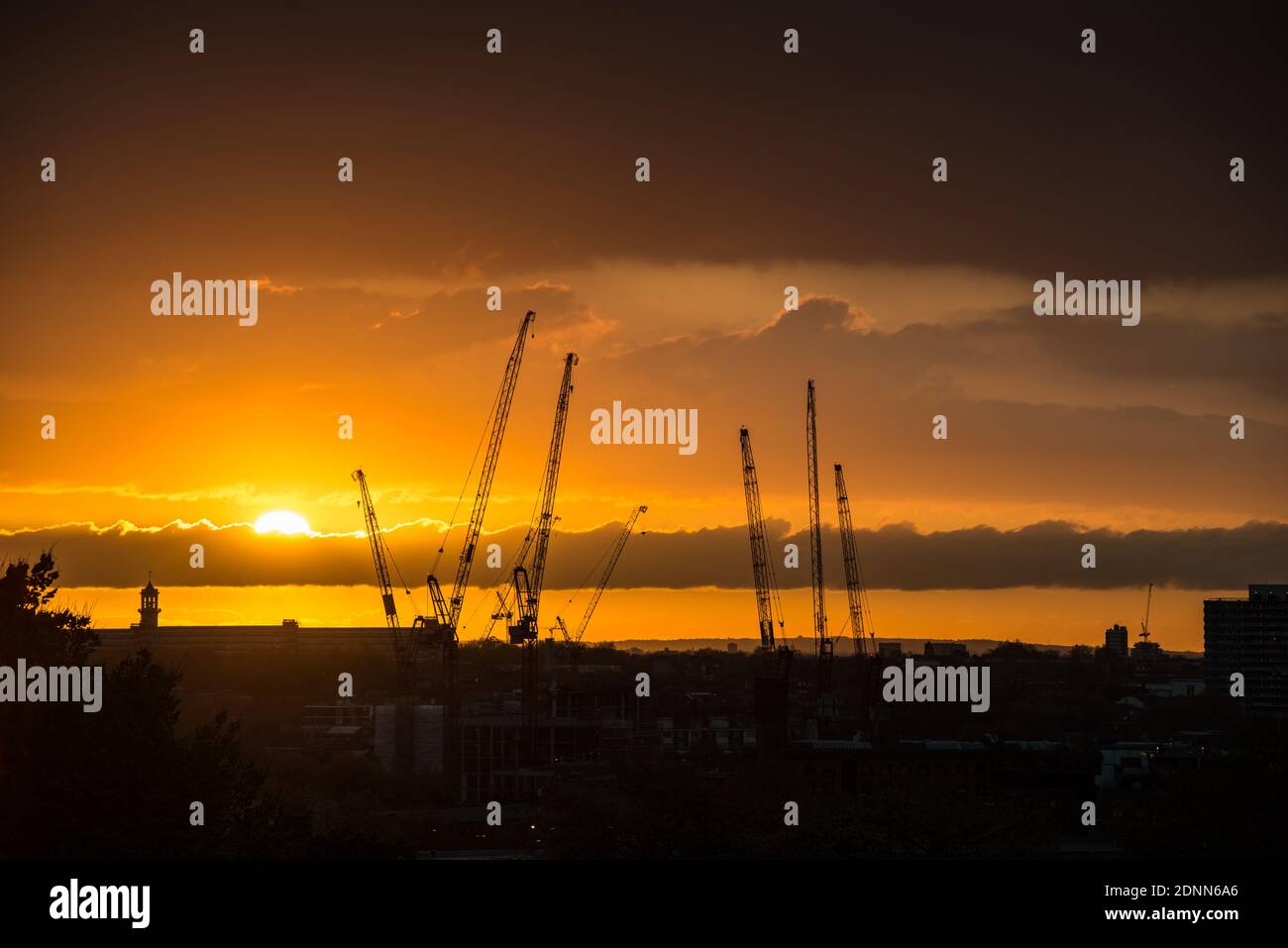 Cranes at dawn in London, England Stock Photo
