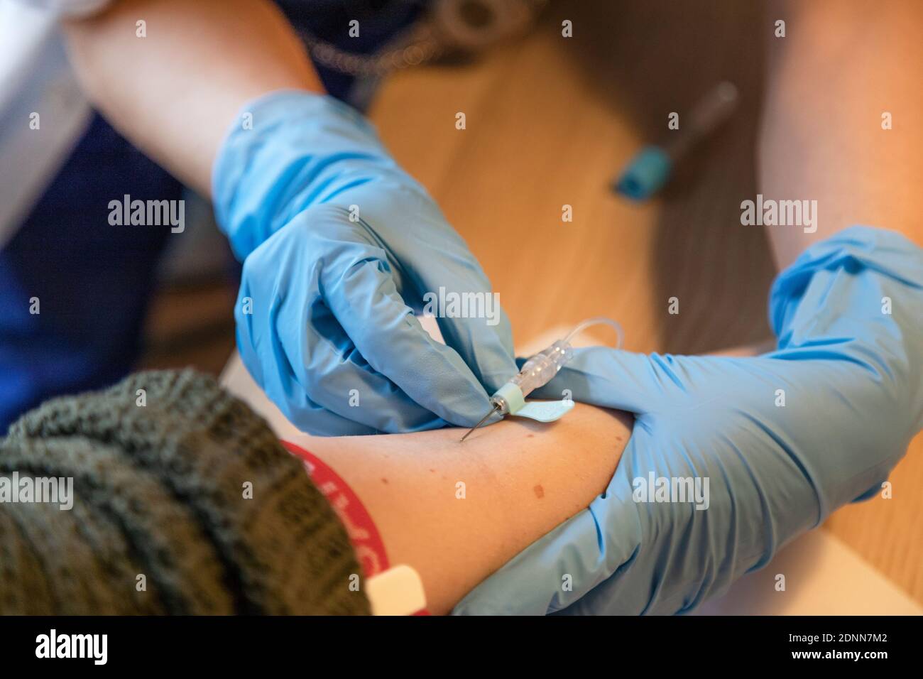Nurse is taking blood of patient Stock Photo