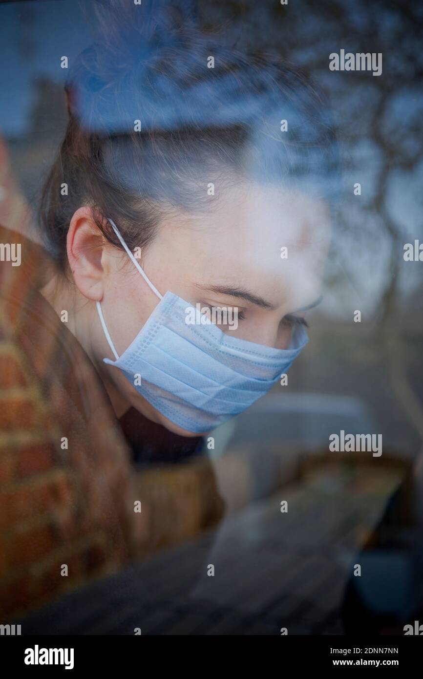 Woman wearing protective mask Stock Photo