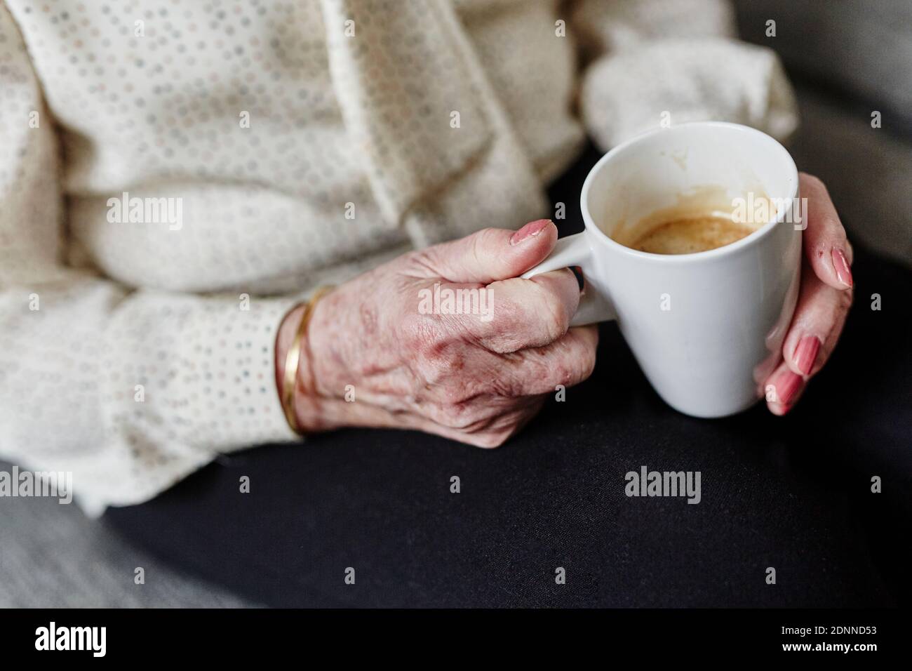 Womans hands holding mug Stock Photo