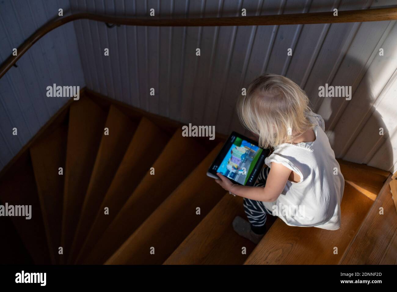Girl using digital tablet Stock Photo