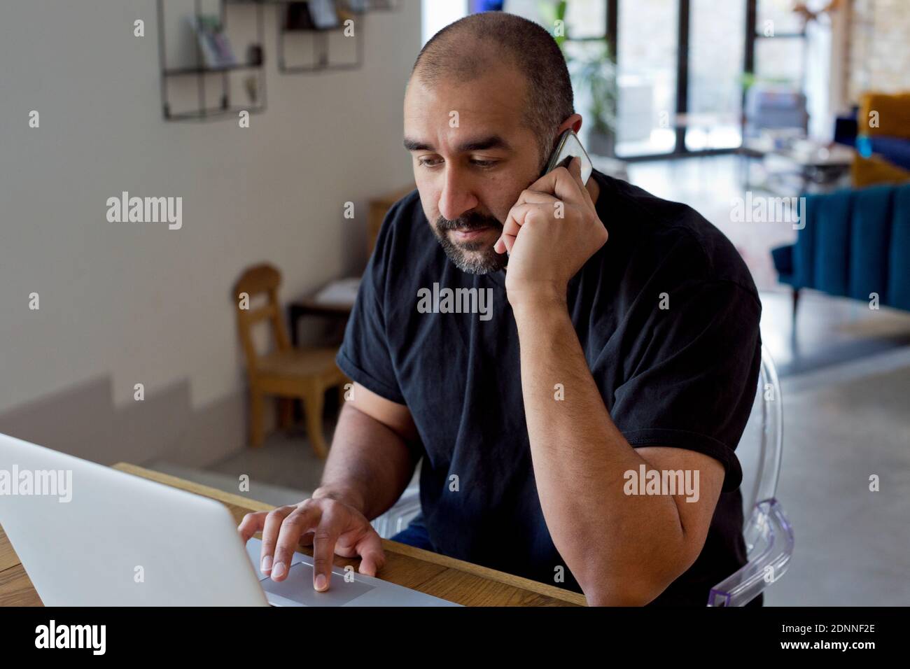 Indian man using laptop home hi-res stock photography and images - Alamy
