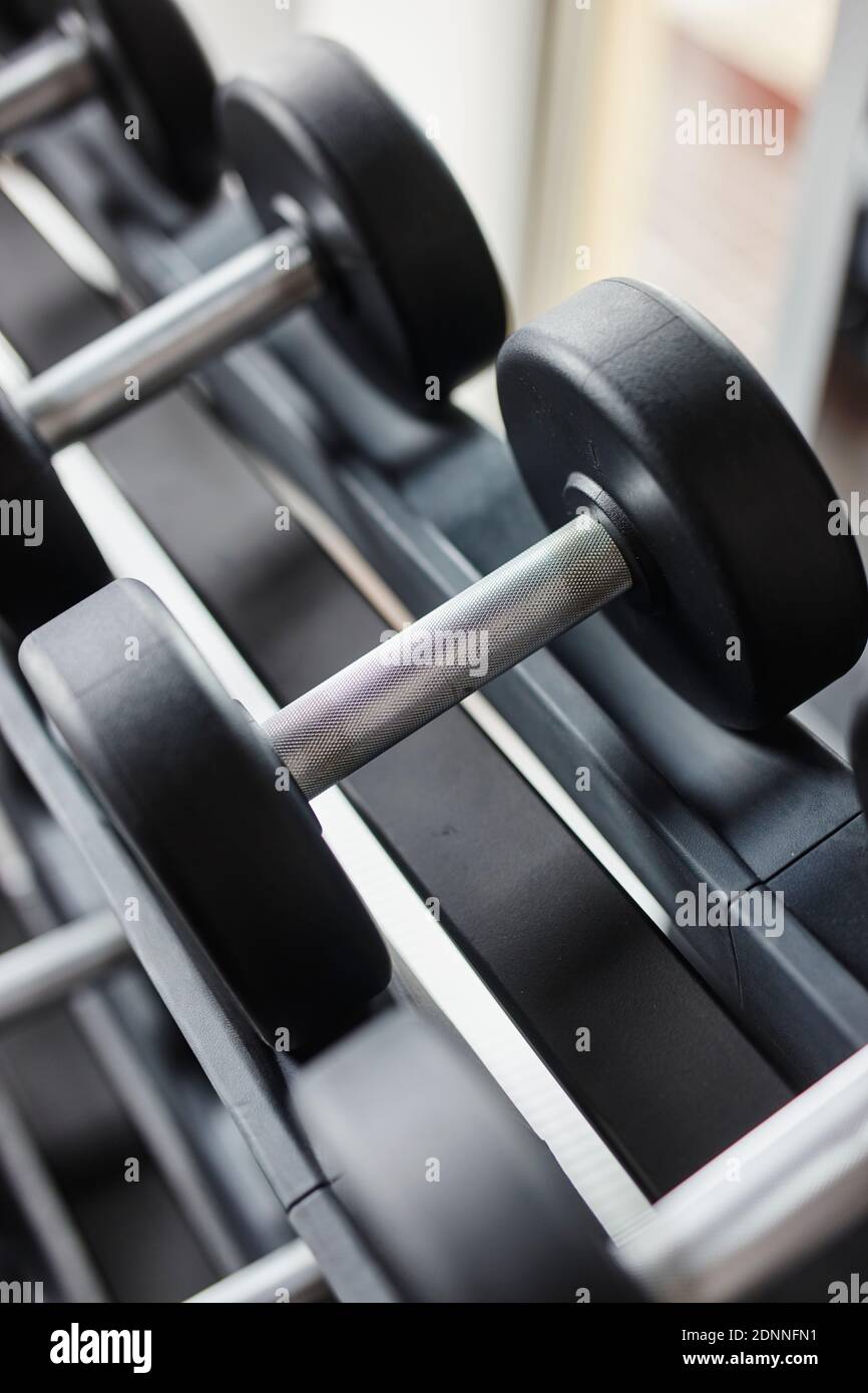 Dumbbells on rack Stock Photo - Alamy