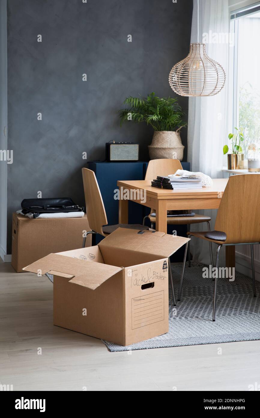 Cardboard box in dining room Stock Photo - Alamy
