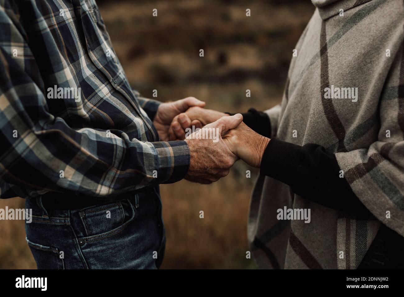 Senior couple holding hands Stock Photo