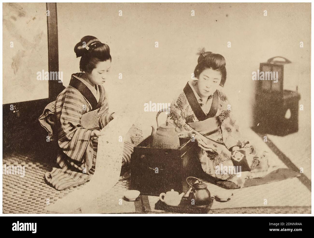 Japanese tea ceremony, albumin paper, black and white positive process, Total: Height: 12.5 cm; Width: 17.9 cm, travel photography, young woman, girl, national costume, regional costume Stock Photo