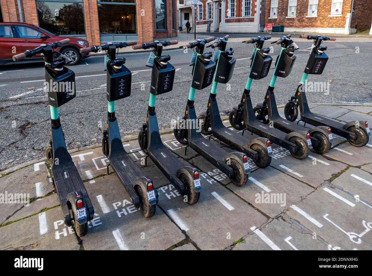 TIER E-scooters E scooter electric scooters for hire parked in street city town centre York North Yorkshire England UK United Kingdom GB Great Britain Stock Photo