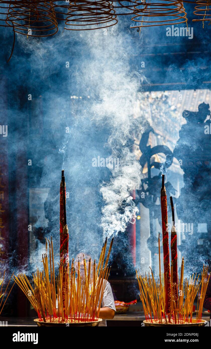 Smoke from incense sticks burning in Thien Hau Temple, a Chinese Temple of sea goddess Mazu, in downtown Saigon (Ho Chi Minh City), south Vietnam Stock Photo