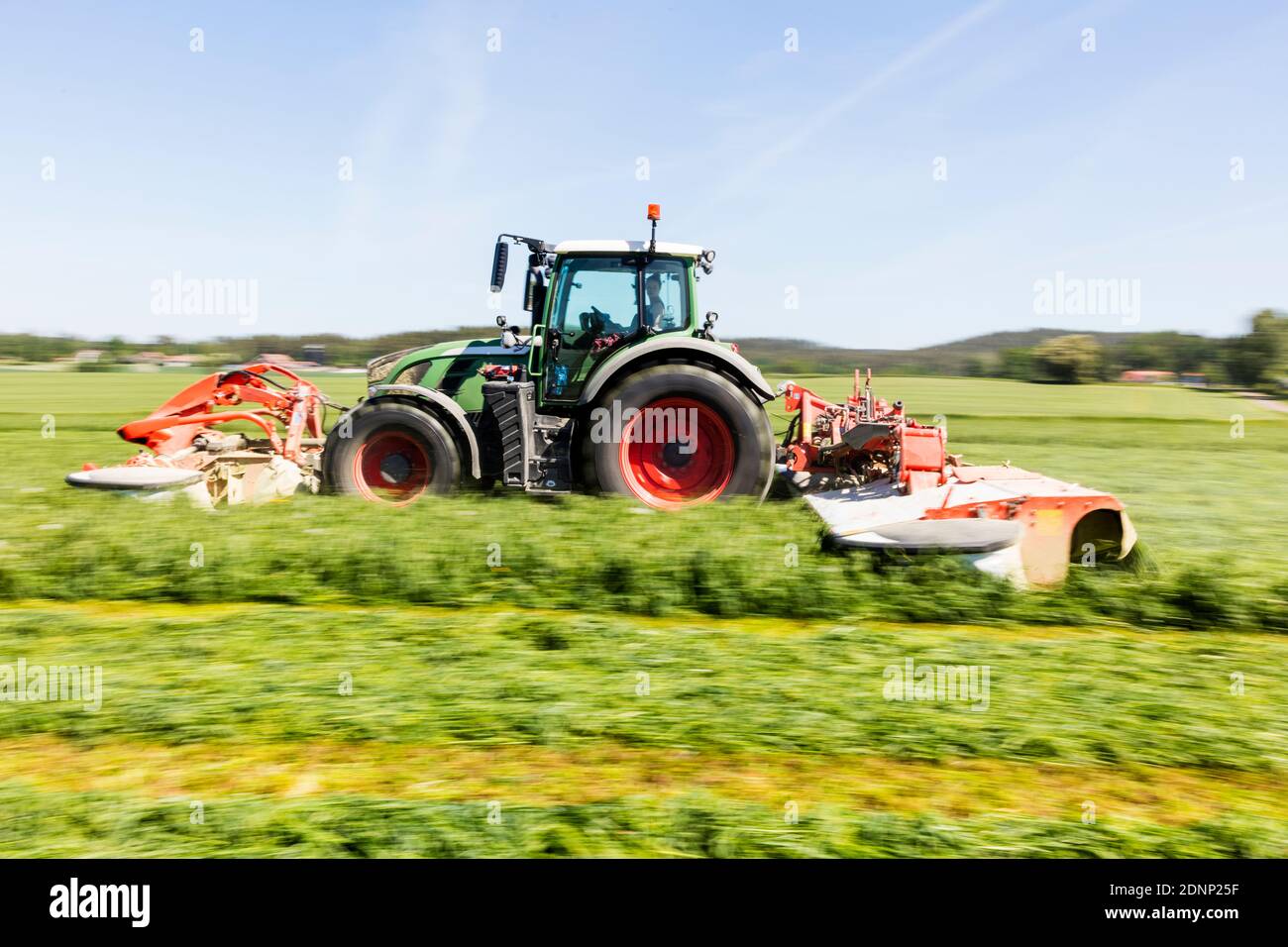Tractor mowing grass Stock Photo Alamy