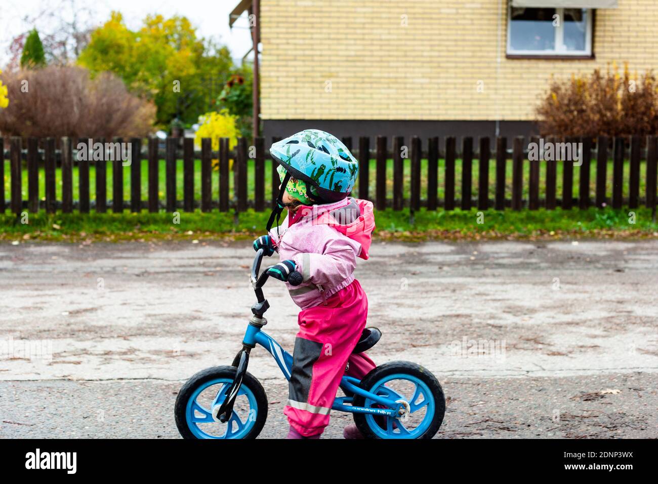 Girl on balance bike Stock Photo Alamy
