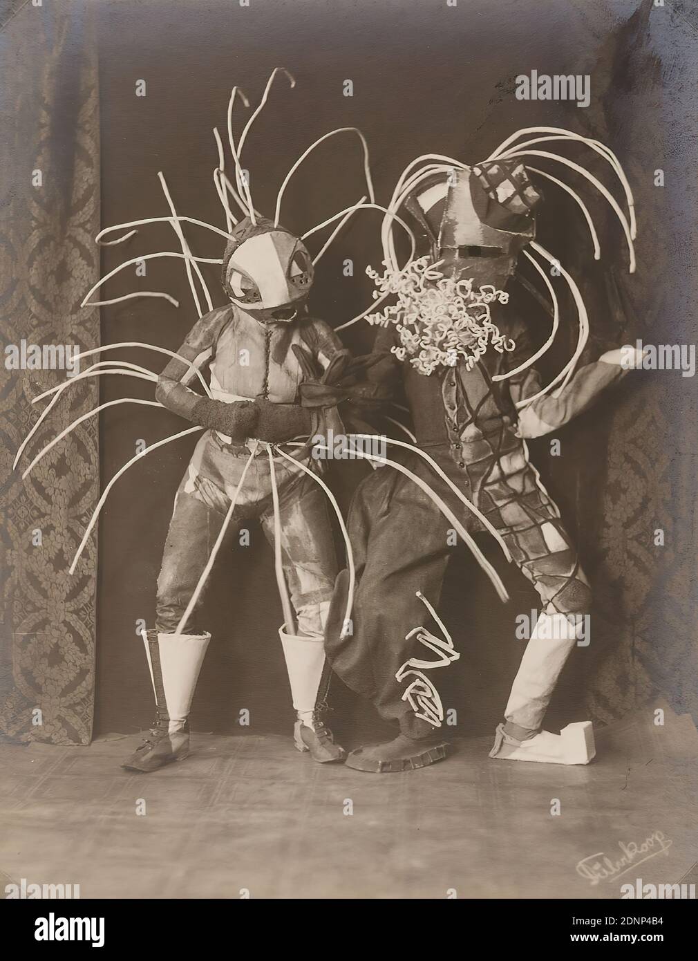 Minya Diez-Dührkoop, dance masks Toboggan Woman and Toboggan Man by Lavinia Schulz, silver gelatine paper, black and white positive process, picture size: height: 21,50 cm; width: 16,70 cm, signed, handwriting copied into the picture: Dührkoop, inscribed: recto and on the cardboard: handwritten in lead: old and new inv.no, repro no, theater photography, dancing Stock Photo