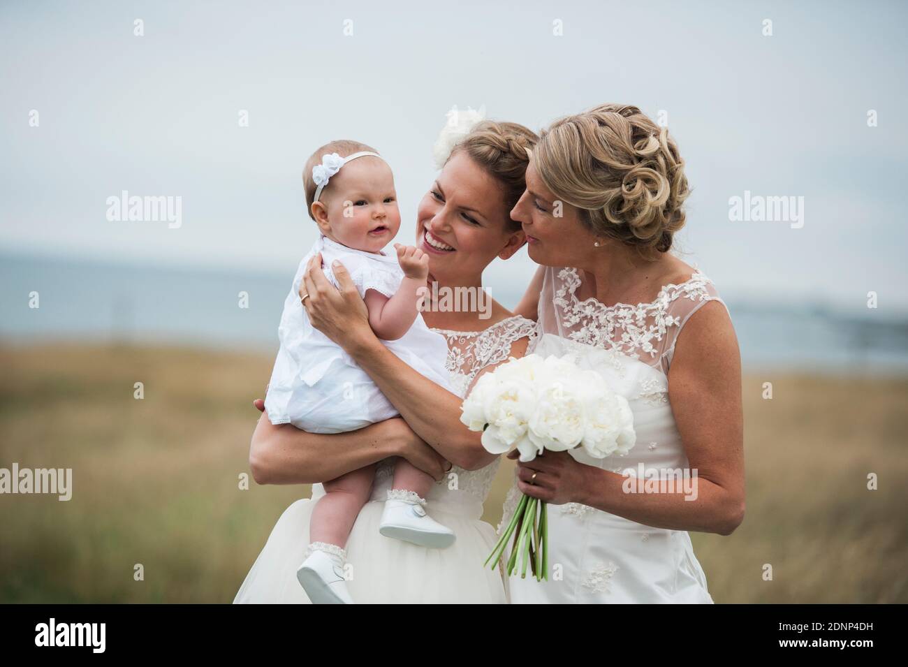 Brides with baby girl Stock Photo