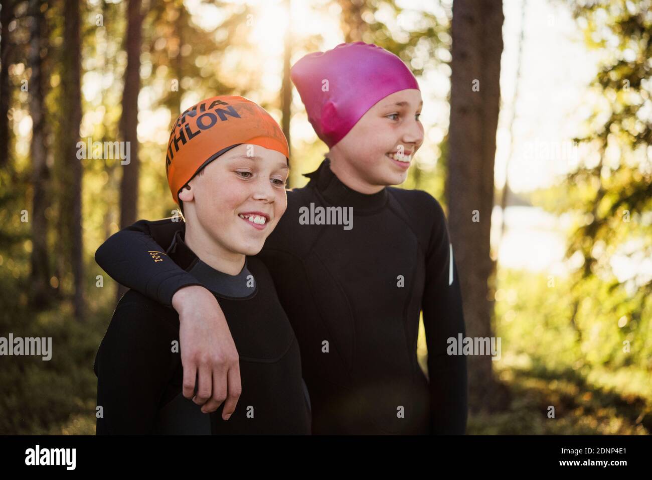 Boy and girl wearing swimming caps Stock Photo Alamy