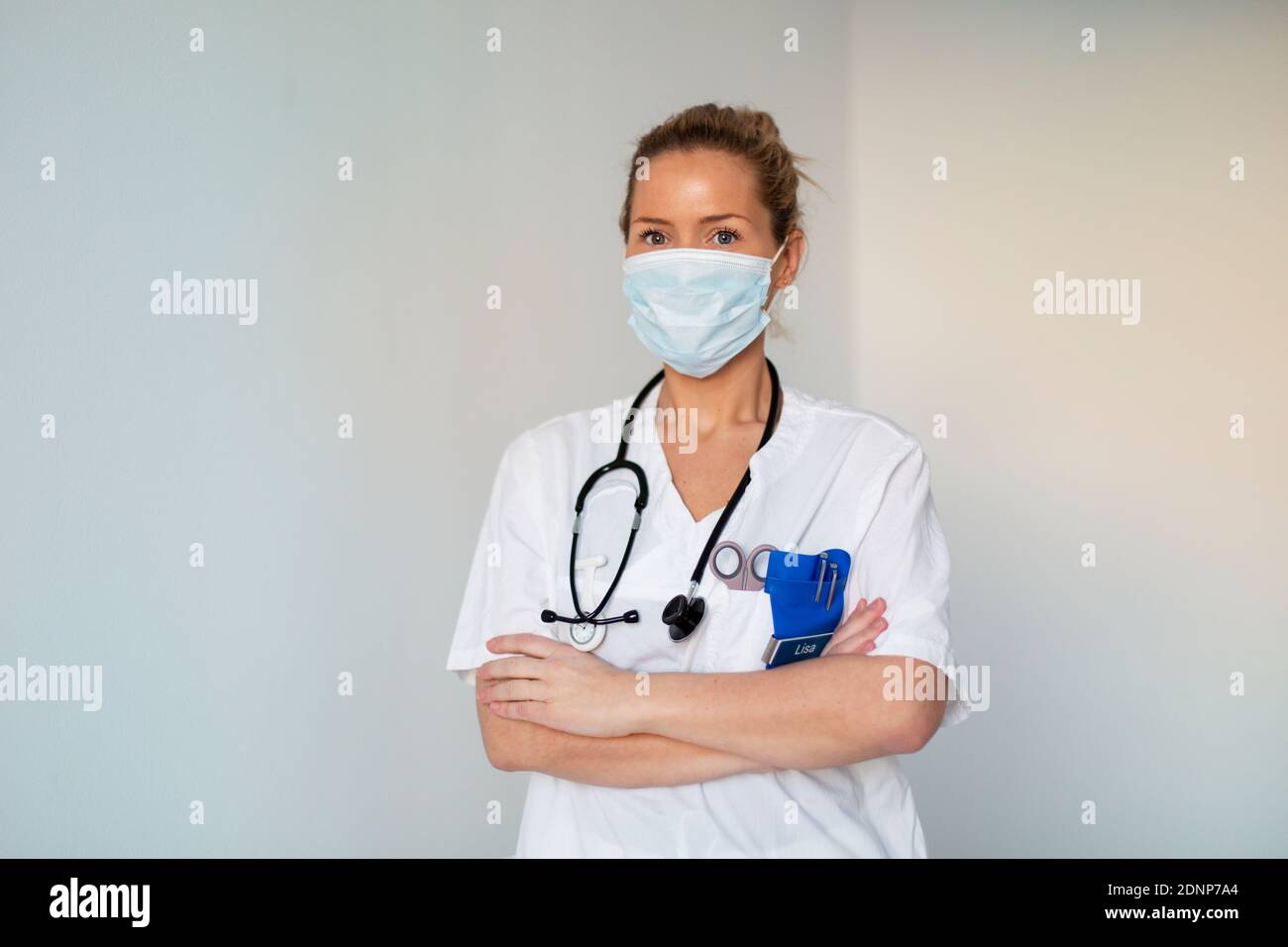 Female doctor wearing face mask Stock Photo