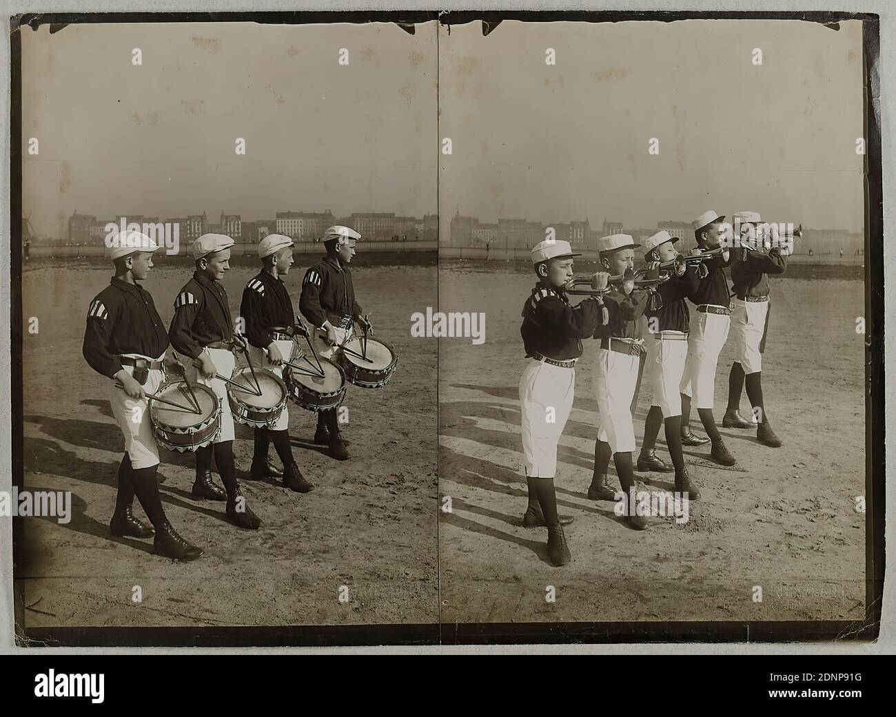 Heinrich Hamann, Atelier J. Hamann, Johann Hinrich W. Hamann, Boys' Music Train of the Hamburg St. Pauli T.V, silver gelatin paper, black and white positive process, Total: Height: 18,30 cm; Width: 25,20 cm, Dry stamp: recto and: J. HAMANN /Hamburg (2x), J. Hamann, Hamburg 1, Neustädterstr, 66/68, Atelier für Photographie aller Art, Awarded Hamburg 1899; J. Hamann, Hamburg 36, Valentinskamp, 41, Atelier für Photographie aller Art, Awarded Hamburg 1899; All film and reproduction rights reserved (2x), titled and dated: verso: handwritten in lead: Hamburg 1902 Knaben Musikzug des Hambg St. Pauli Stock Photo