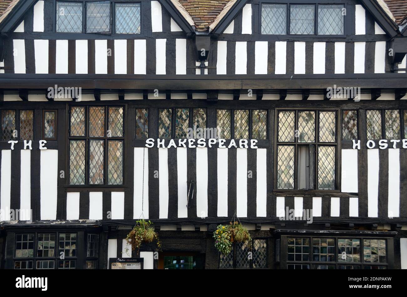 Window Patterns of Medieval Half-Timber Building or Post-and-beam Construction of The Shakespeare Hotel in Stratford-upon-Avon England Stock Photo