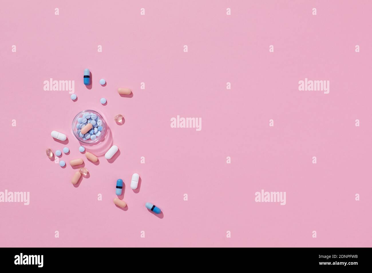 Pills on pink background Stock Photo