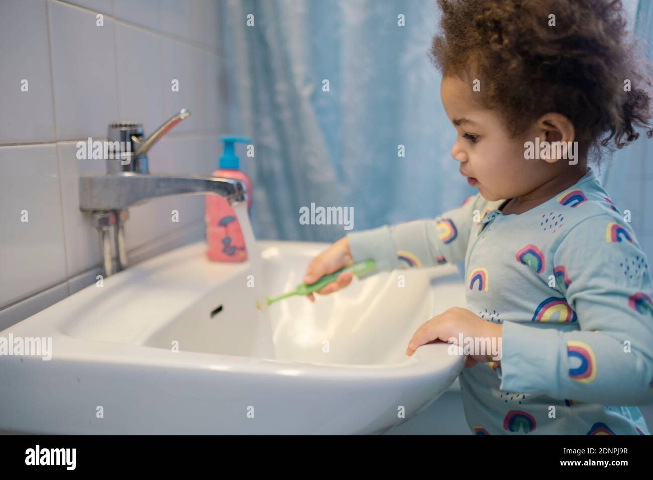 Toddler girl in bathroom Stock Photo Alamy