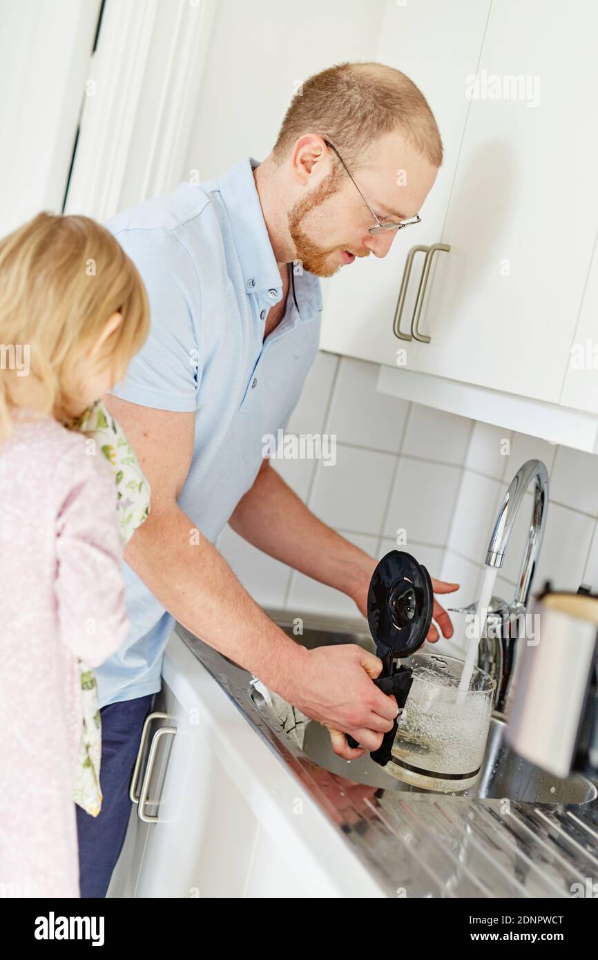 Man filling jug with water Stock Photo Alamy