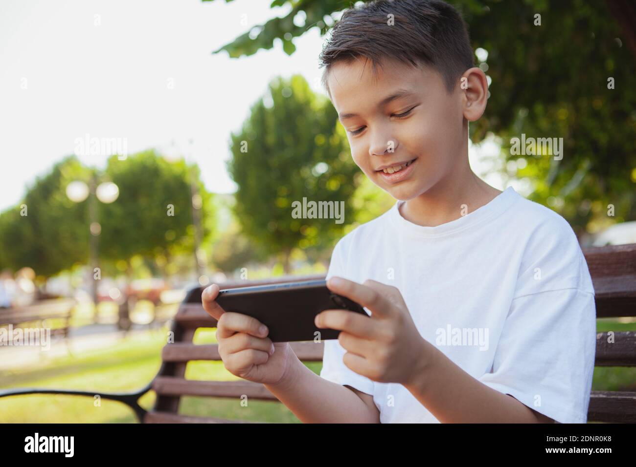 Smiling African Boy Playing Online Games in Class Stock Photo - Image of  phone, modern: 177228872