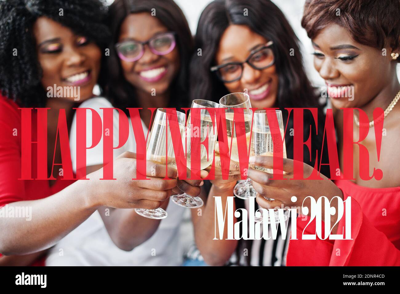 Happy New Year 2021 Malawi! Group of partying african girls clinking glasses with sparkling wine champagne. Stock Photo