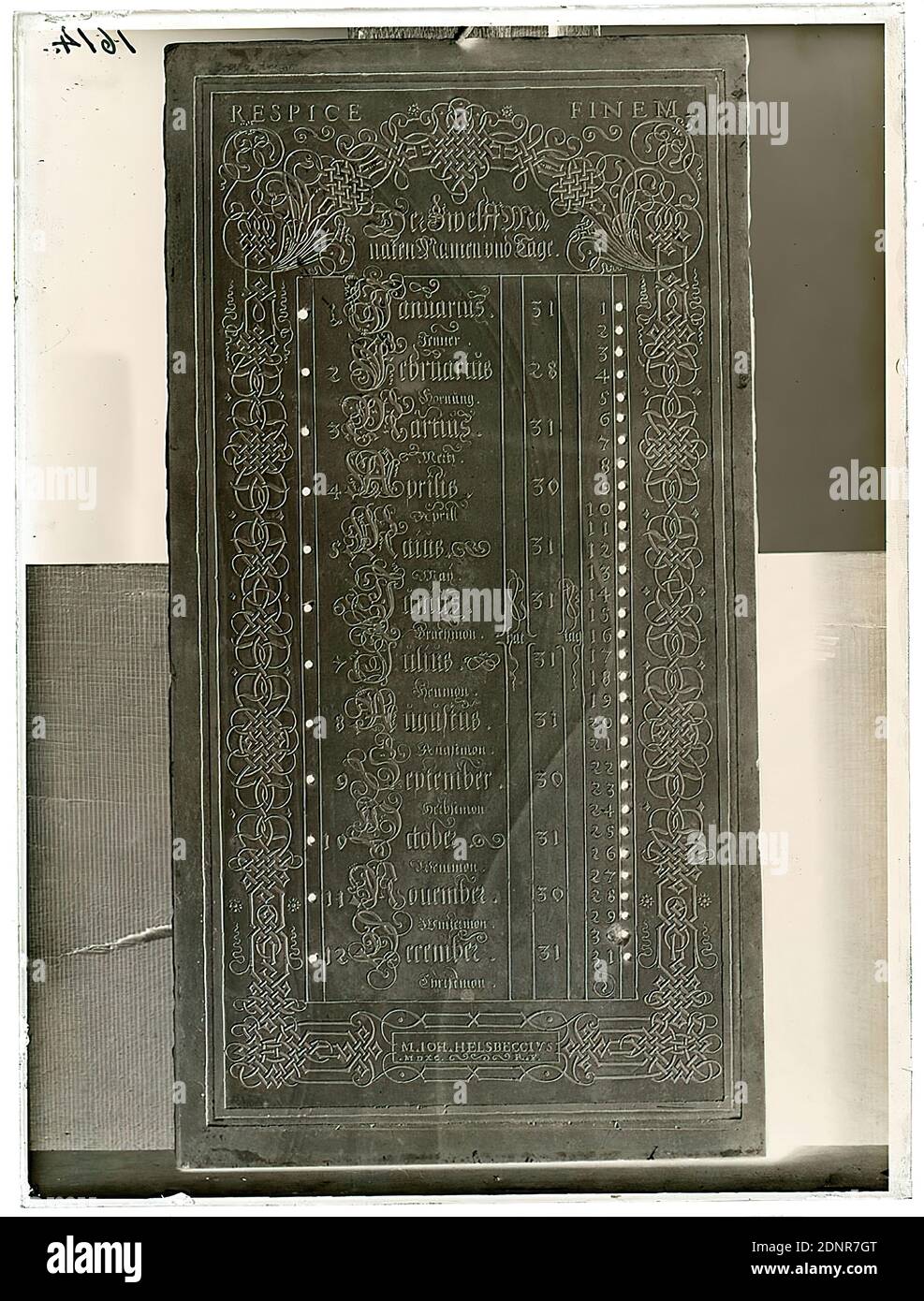 Wilhelm Weimar, Perpetual Calendar, glass negative, black and white negative process, total: height: 23.8 cm; width: 17.8 cm, numbered: top left : in black ink: 1614, work of applied art (stone), calculation of time (chronology)/ time measurement (clock), calendar, almanac, months, month pictures, ornaments, letters, alphabet, writing, arts and crafts, applied arts, industrial design Stock Photo