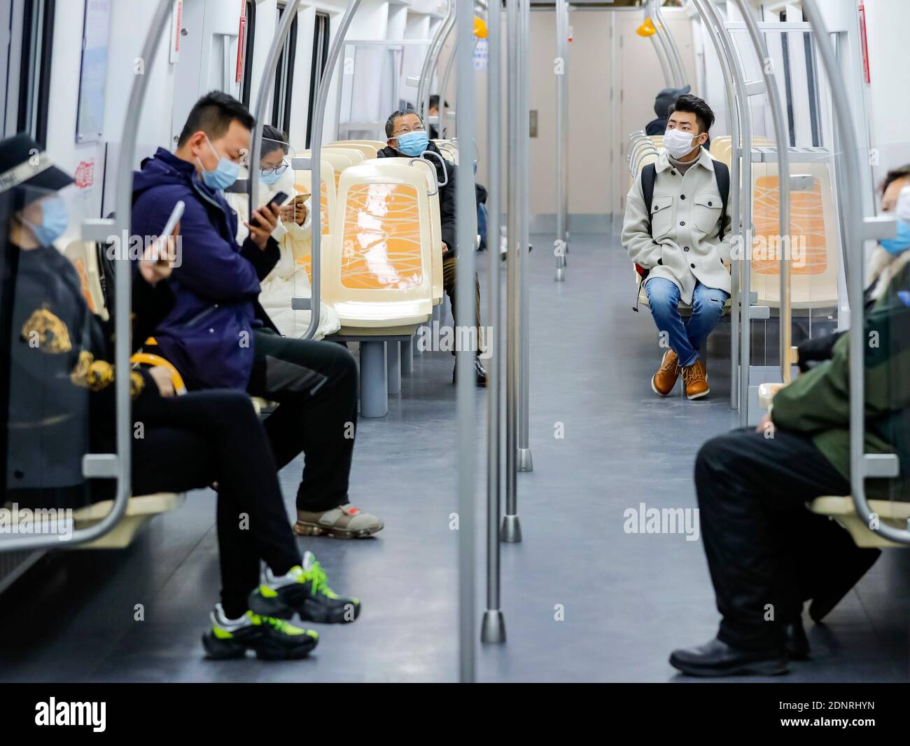 Chengdu, China's Sichuan Province. 18th Dec, 2020. People take a train ...