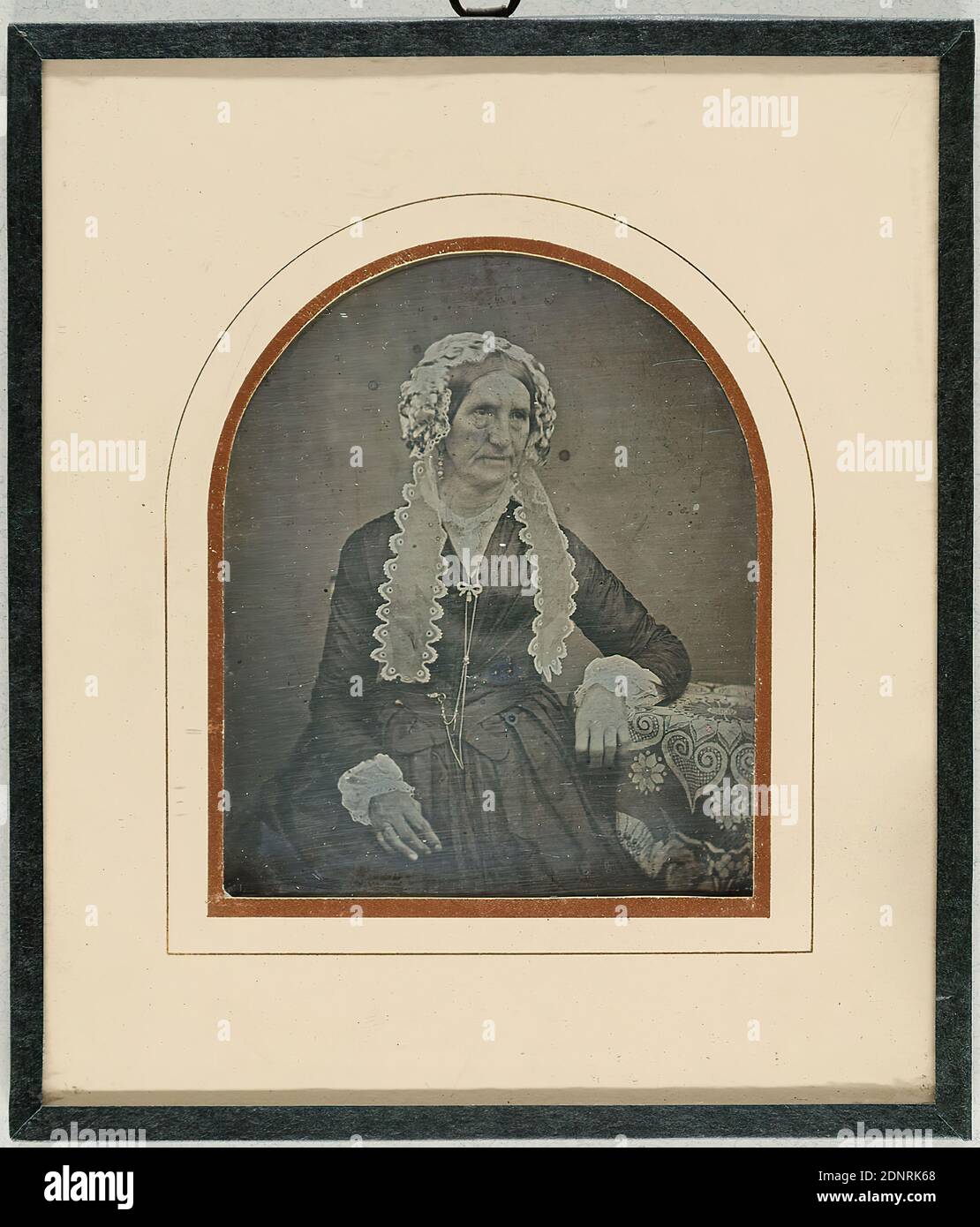 Mrs. Schaumburg, daguerreotype, picture size: height: 7.00 cm; width: 5.80 cm, inscribed: verso middle: in blue ink on label: Mrs. Schaumburg, Great Aunt by, Gustav Brümmer, (sister of Brümmer's grandmother), numbered: verso top left: in black ink: D.S. 500, portrait photography, woman, seated figure, half-figure portrait, headdress Stock Photo