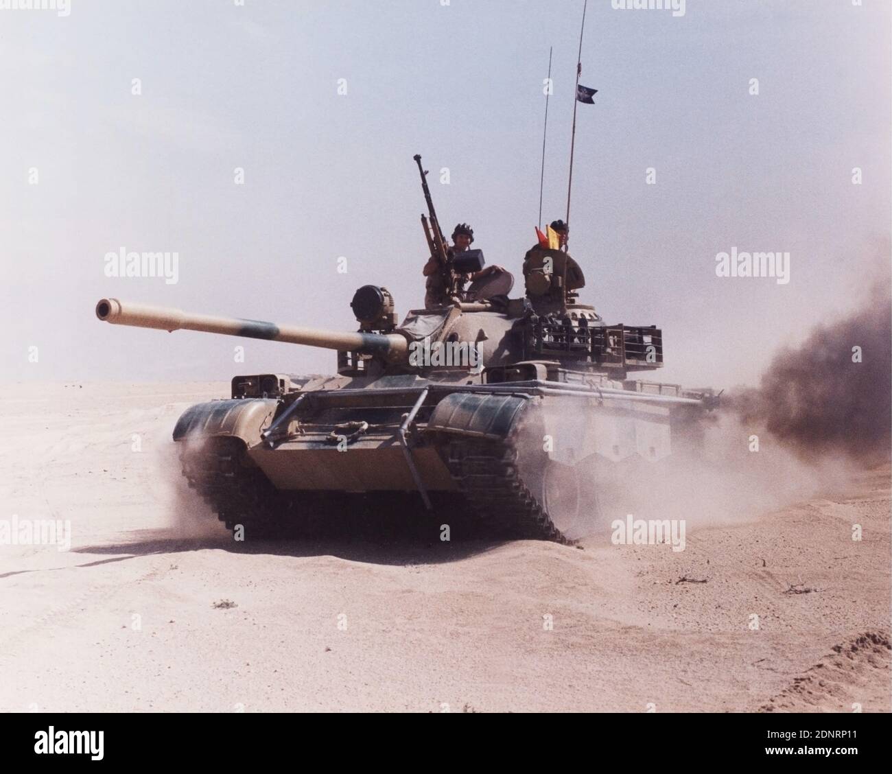 Iraqi Army Russian Chinese T55 tank, captured and crewed by British Army soldiers of 1st Queens Dragoon Guards and REME. Kuwait. Gulf War 1991 Stock Photo