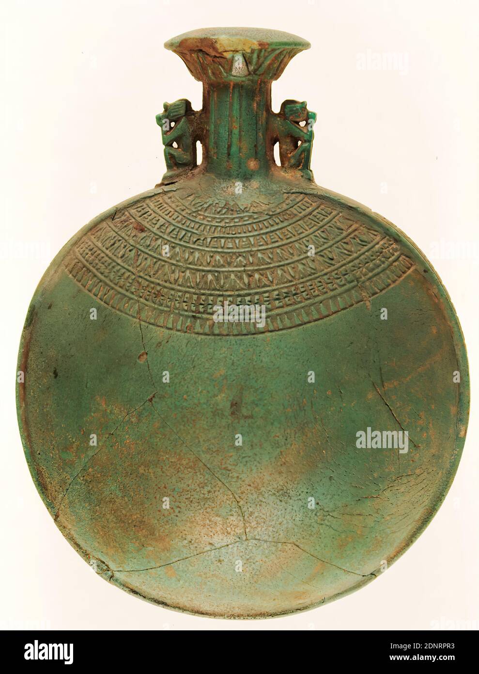 Pilgrim's Bottle (New Year's Bottle), Faience, Faience, Total: Height: 17 cm; Width: 12.5 cm; Depth: 8 cm, Ritual objects and accessories, votive offerings, burial gifts, monkeys, lotus ornament, lotus flower, column, pillar (architecture), antiquity, This form of bottle with a lenticular body and a cylindrical neck is called a pilgrim's bottle. They can be traced in Egypt from the beginning of the New Kingdom from 1530 BC until the Coptic period of the 6th century AD. The equally common designation as New Year's Bottle goes back to the early custom of filling the vessel with perfume Stock Photo