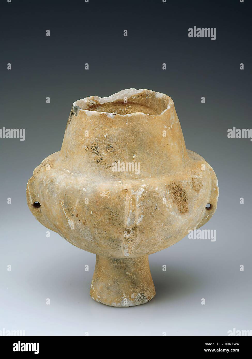 Cone neck vessel, marble, chiseled, smoothed, polished, marble, total: height: 17.8 cm; diameter: 14.5 cm, votive offerings, burial objects, ritual objects and accessories, Aegean Bronze Age, Early Cycladic, FK I, The cone neck vessel from Paros is made of large crystalline, pure white island marble. The surface is patinated yellowish-grey. The hemispherical body with four vertical, pierced ribs rests on a high conical base that is slightly inwardly indented. They once served to pull a hanging cord through. The neck tapers conically; the muzzle-edge is set off plastically Stock Photo