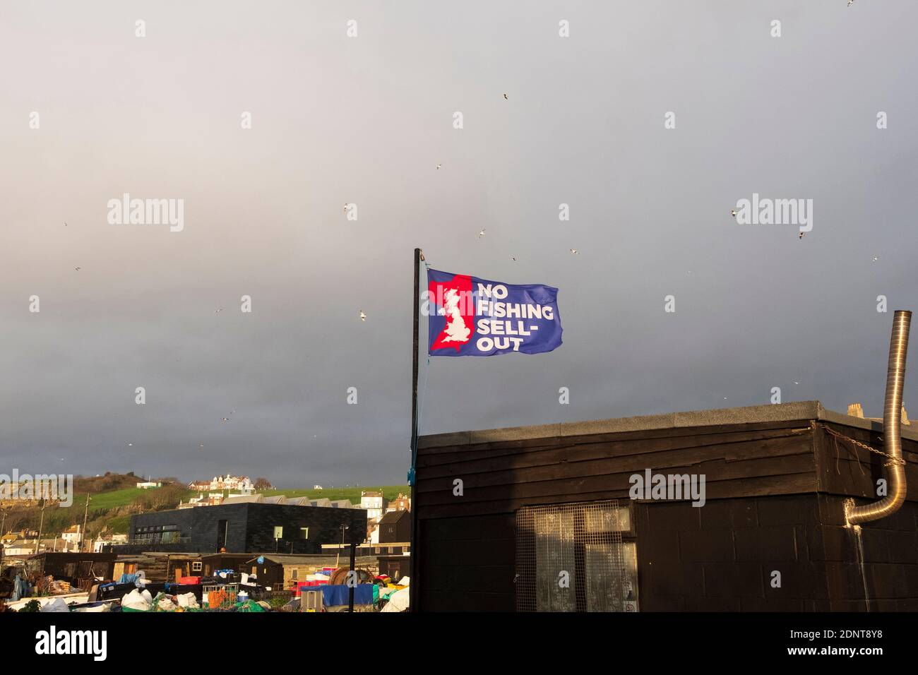 Hastings, East Sussex, UK. 18th December 2020. Dark clouds gather over the fishing boat beach, as fishing rights are still a sticking point in the EU/Brexit negotiations. C.Clarke/Alamy Live News Stock Photo