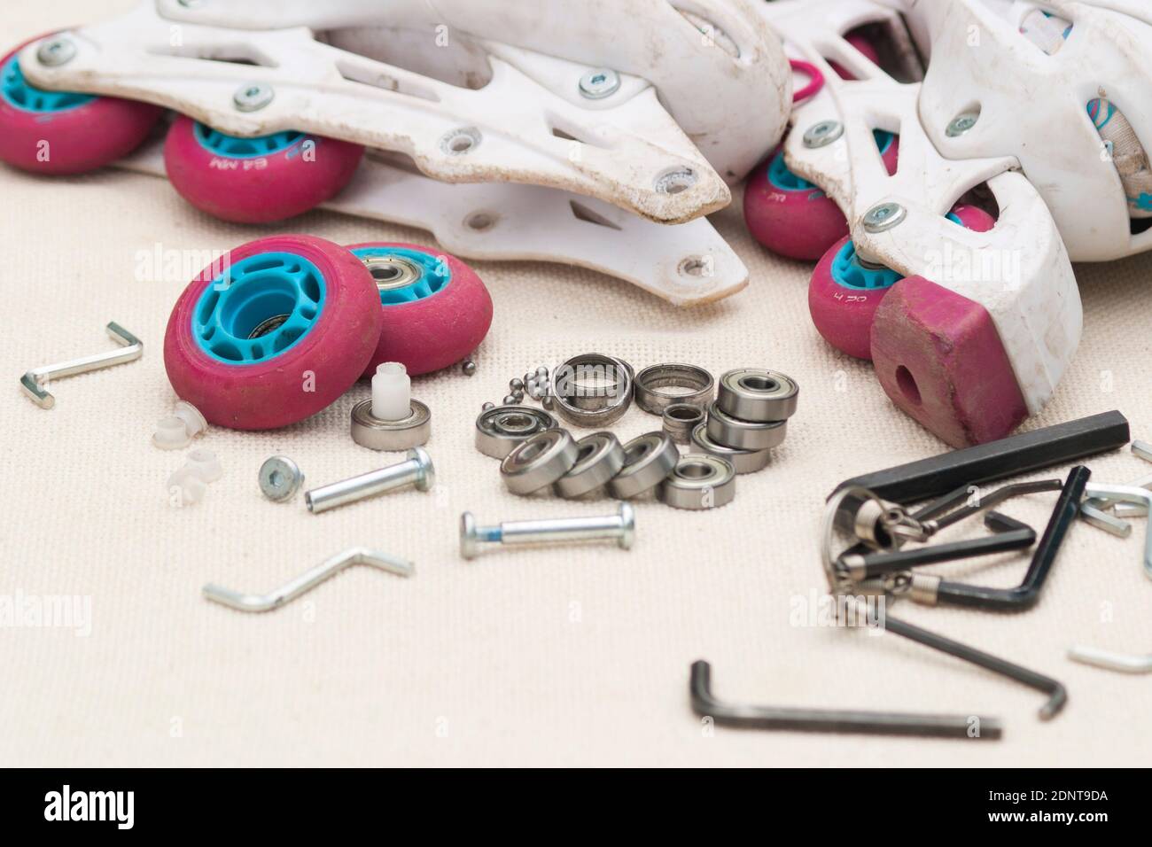 Roller skate bearing replacement. Disassembled roller skates, new and