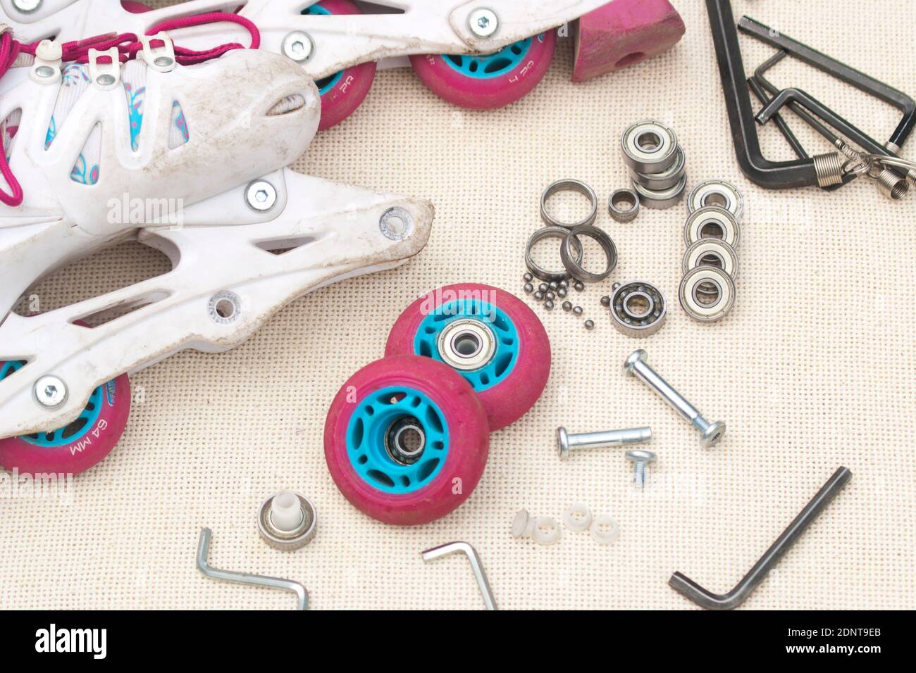 Roller skate bearing replacement. Disassembled roller skates, new and