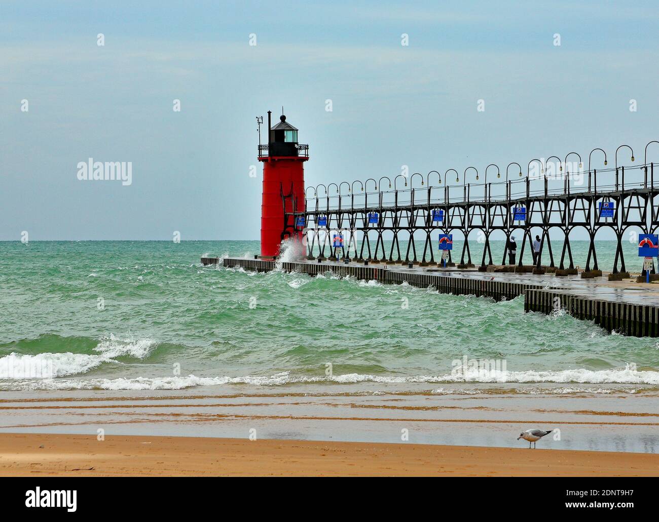 South Haven Lighthouse on a windy day with waves and spray Stock Photo