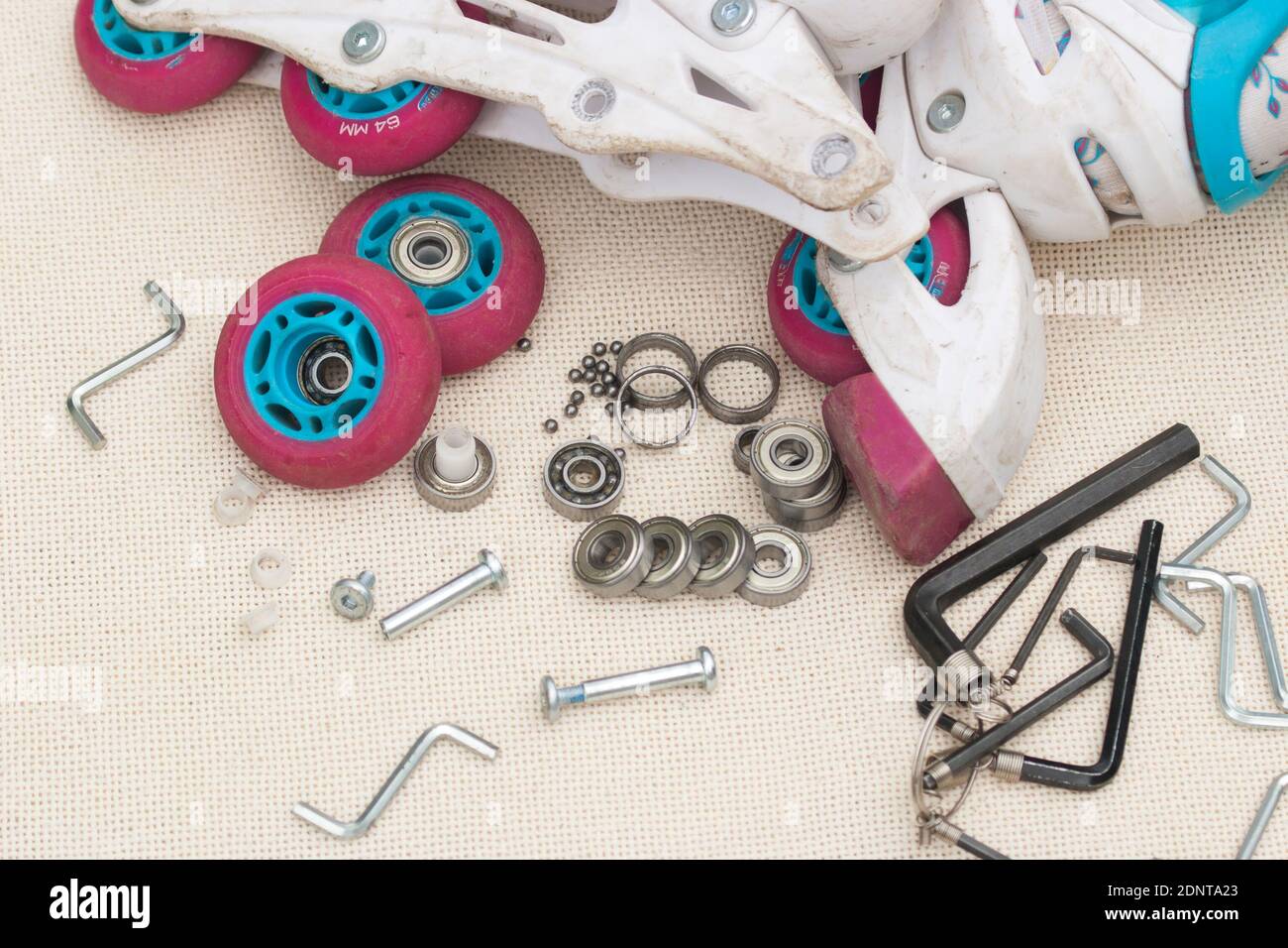 Roller skate bearing replacement. Disassembled roller skates, new and