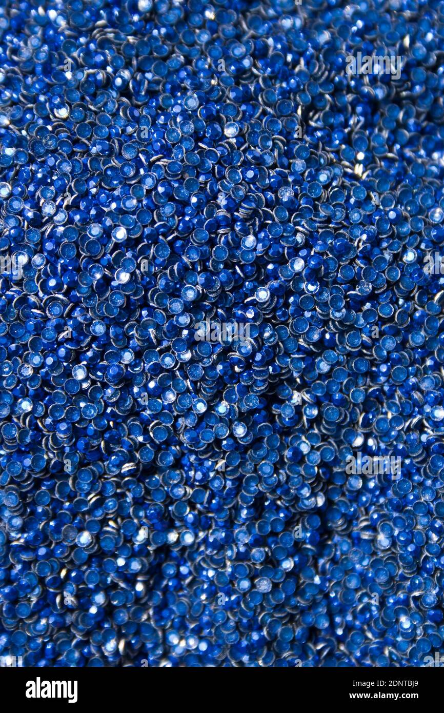 Adhesive rhinestones. A lot of blue glue rhinestones. Background Stock Photo