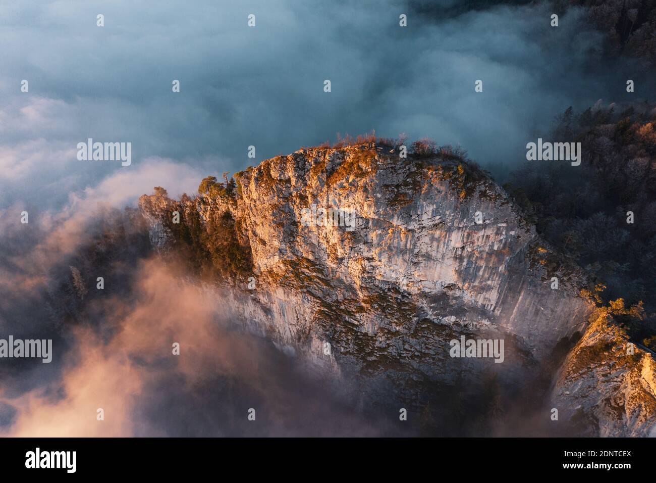 Aerial view of a mountain ridge rising through the clouds, Hallein, Salzburg, Austria Stock Photo