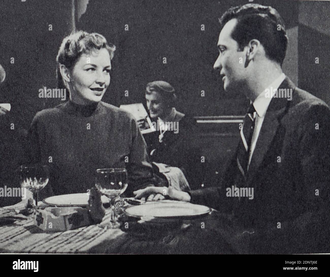 Film still from 'The Young Lovers' starring Paul Carpenter, Theodore Bikel, David Kossoff, and Odile Versois. Stock Photo