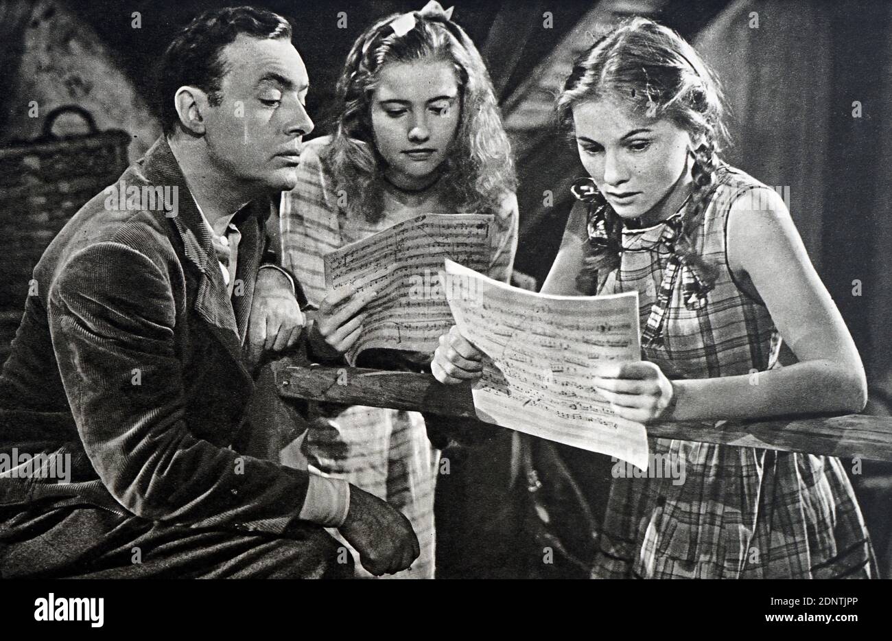 Film still from 'The Constant Nymph' starring Joan Fontaine, Charles Boyer, Alexis Smith, and Peter Lore. Stock Photo