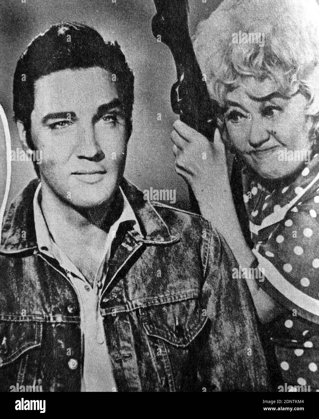 Film still of Elvis Presley (1935-1977) and Joan Blondell (1906-1979) in 'Stay Away, Joe'. Stock Photo