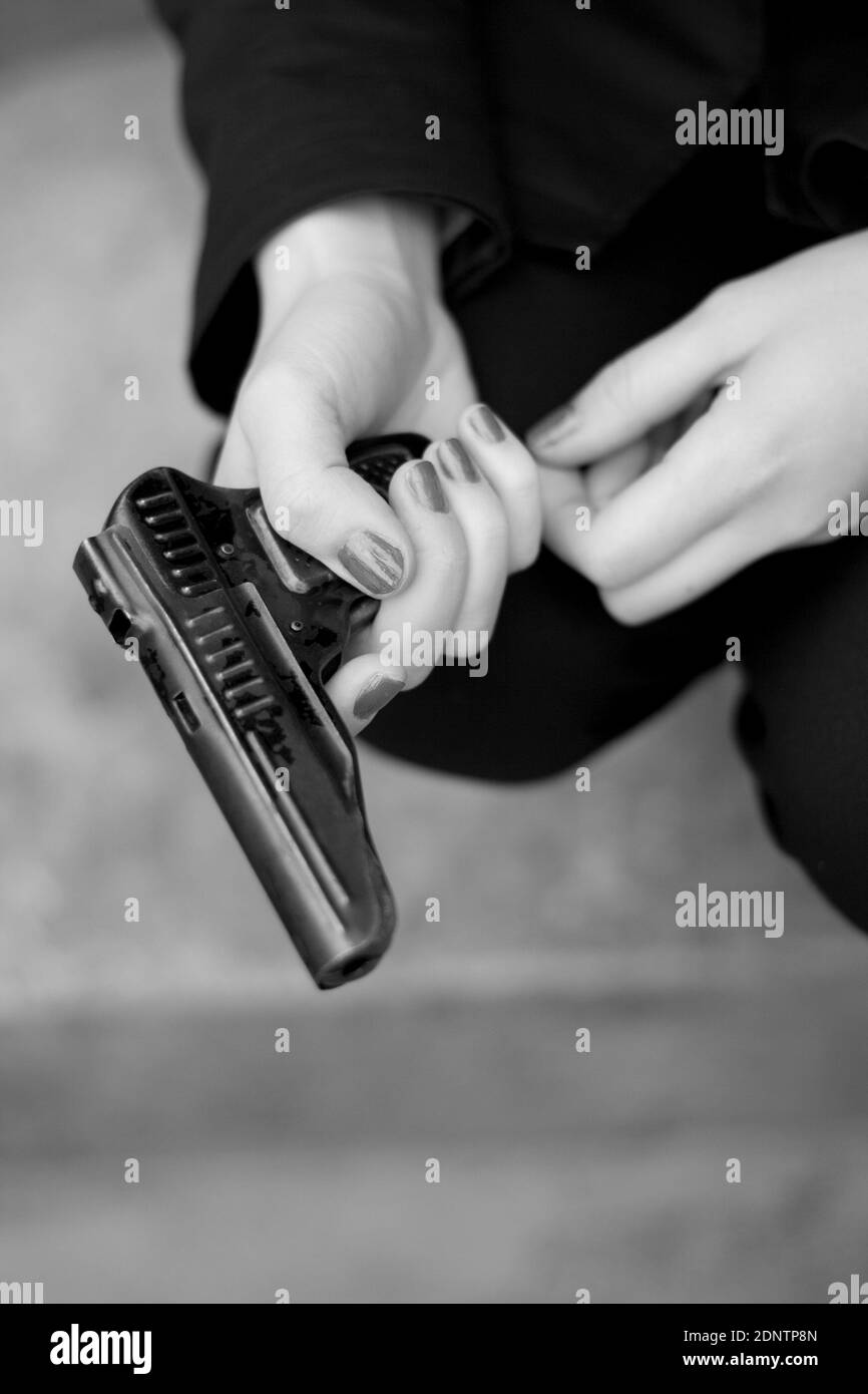 Hand holding gun close up Black and White Stock Photos & Images Alamy